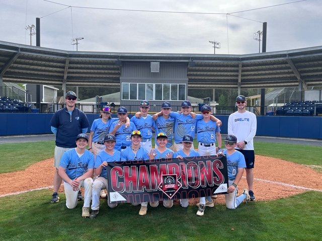 BRE champions with the tournament banner