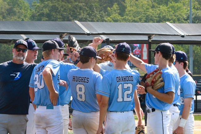 BRE coach with players before a game