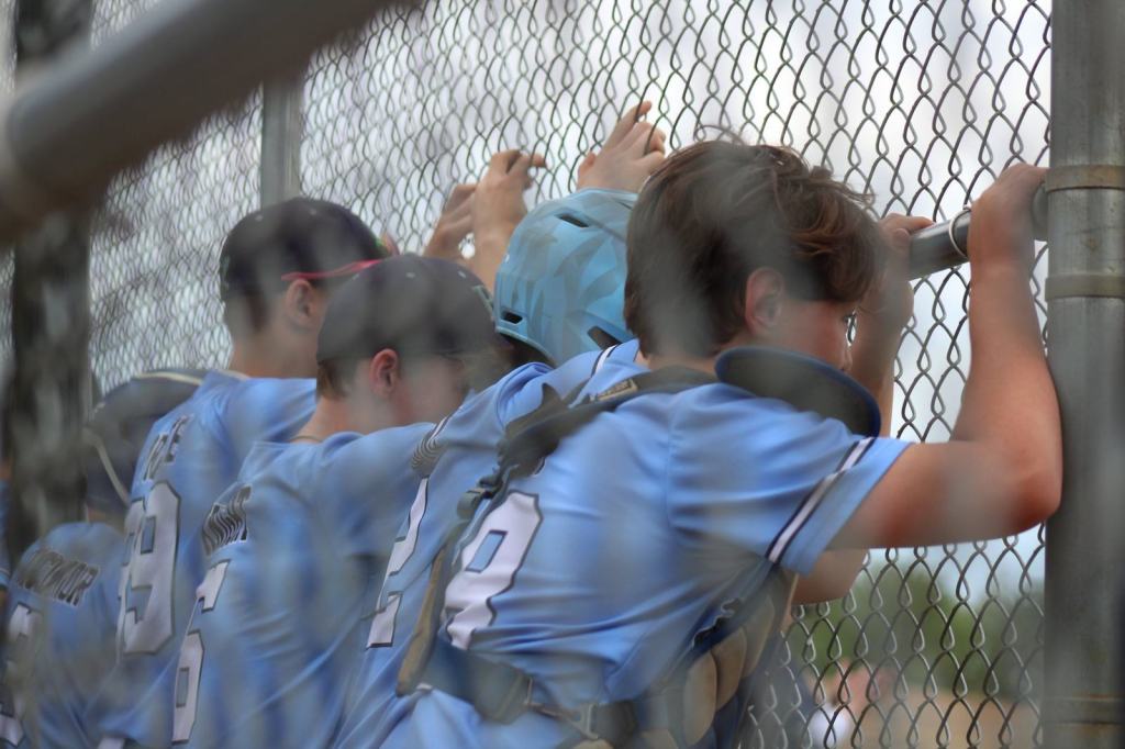 BRE players watching from the fence