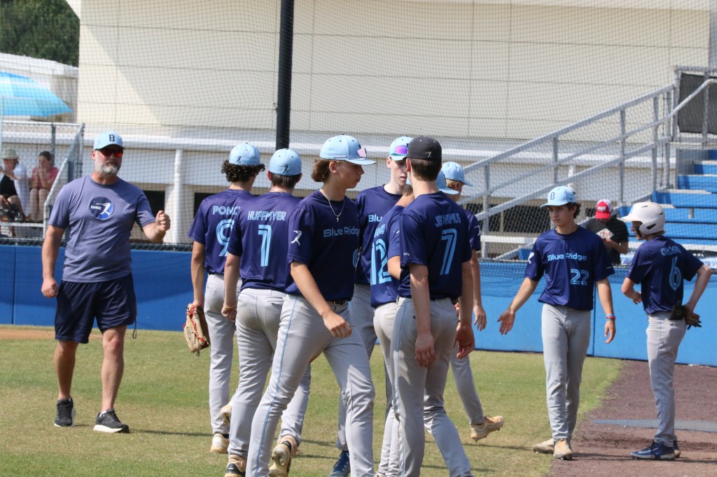 BRE Fall 17U-18U players and coach on the field