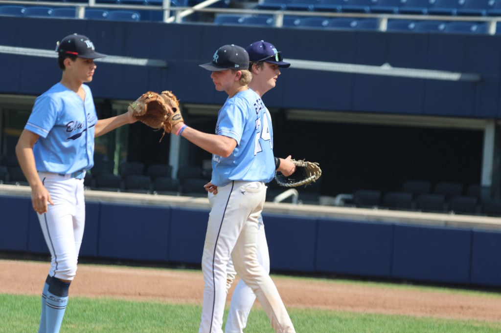 BRE Fall 15U players celebrate between innings